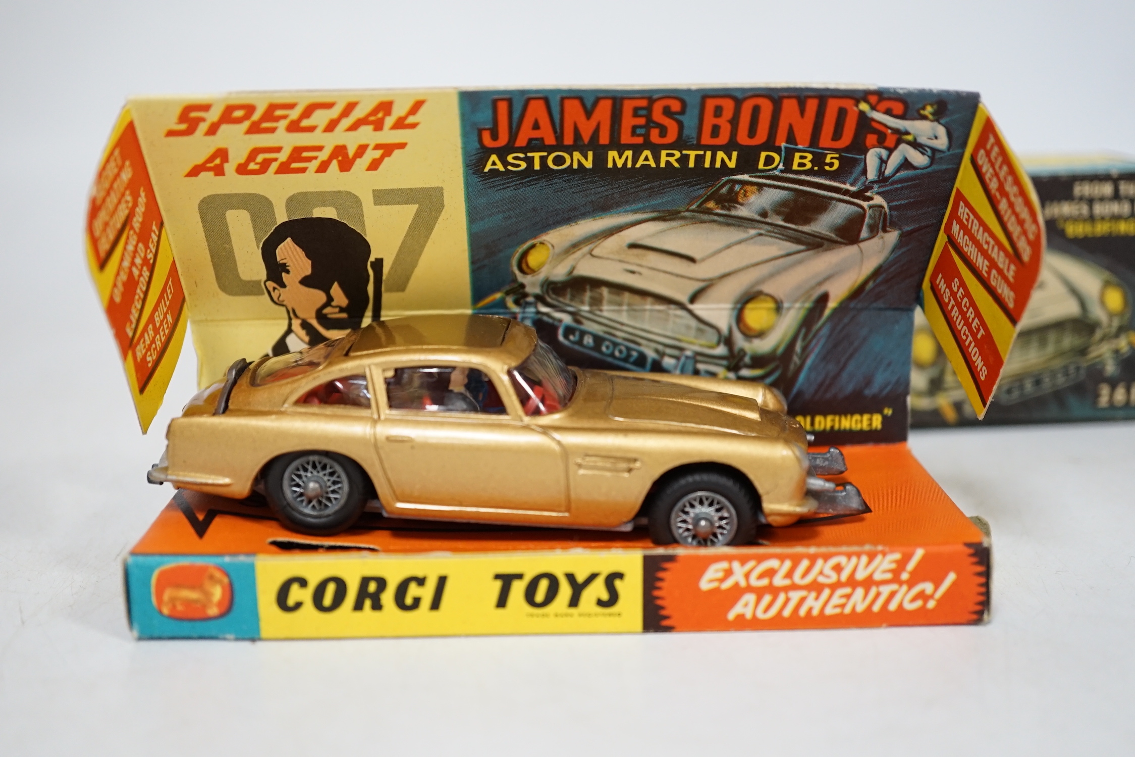 Corgi Toys James Bond's Aston Martin (261) in gold, boxed with driver, passenger, inner display tray, correct leaflet advertising other Corgi models and a ‘Secret Instructions’ envelope containing instructions and unused